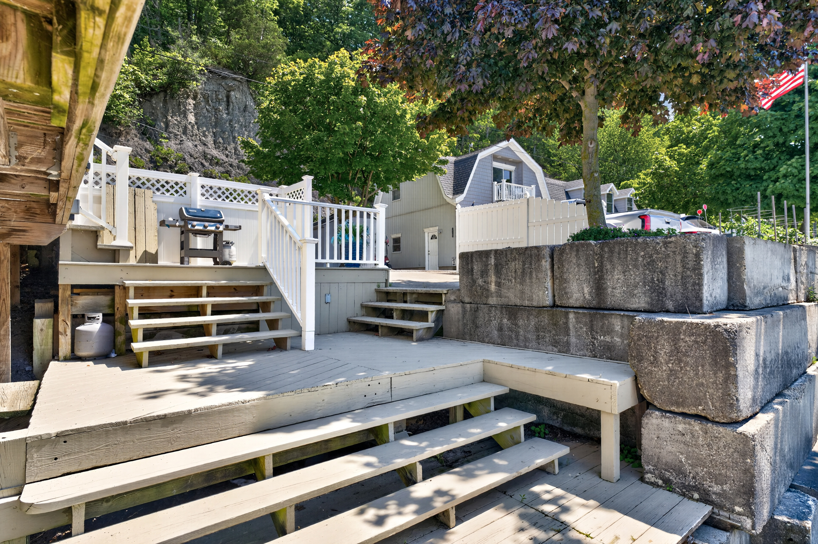 Exterior steps beside the stone retaining wall