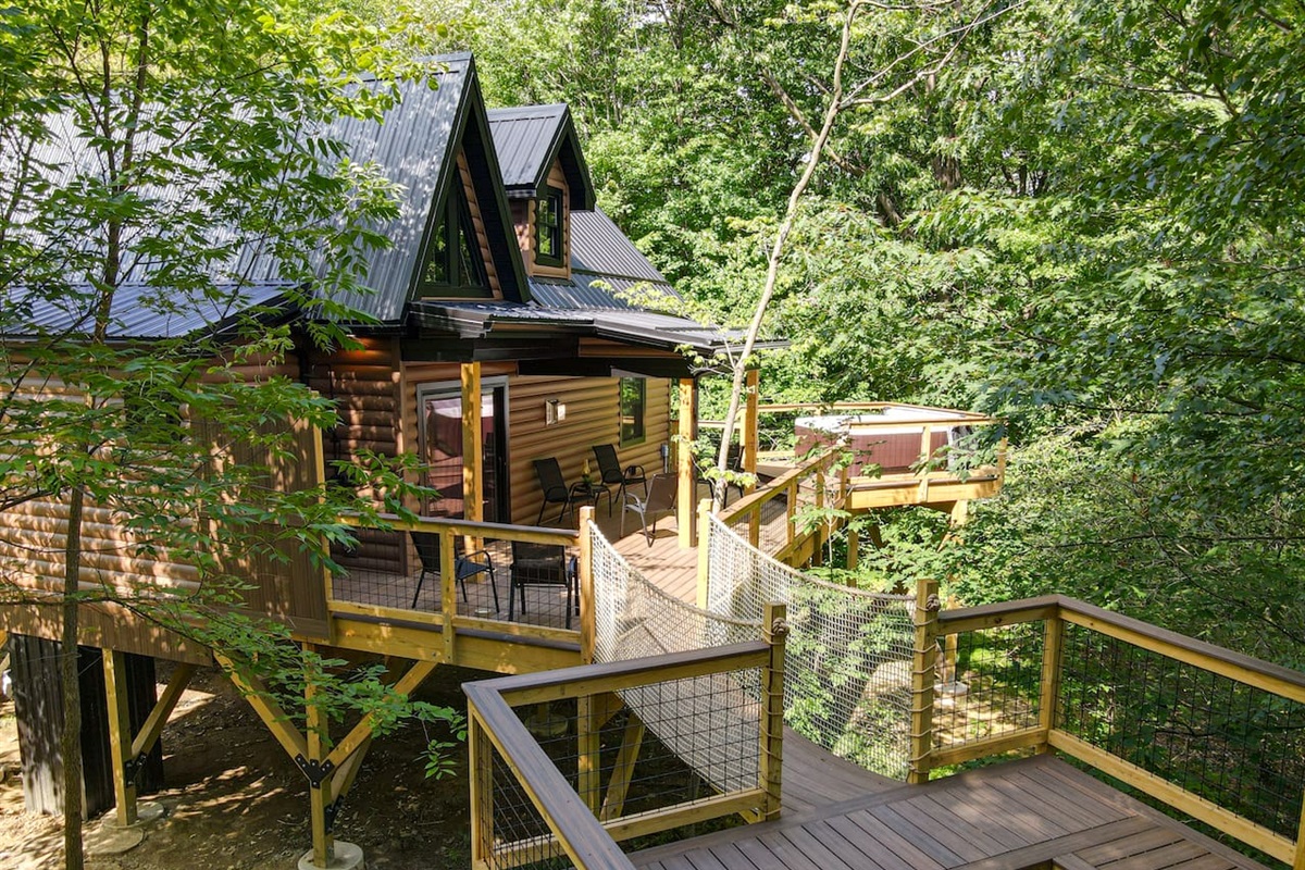 The perfect blend of comfort and nature. Take some time to sit back and relax. Enjoy the elevated hot tub and refreshing outdoor shower. The hammock built into the deck floor provides a unique experience to help you unwind amongst the trees