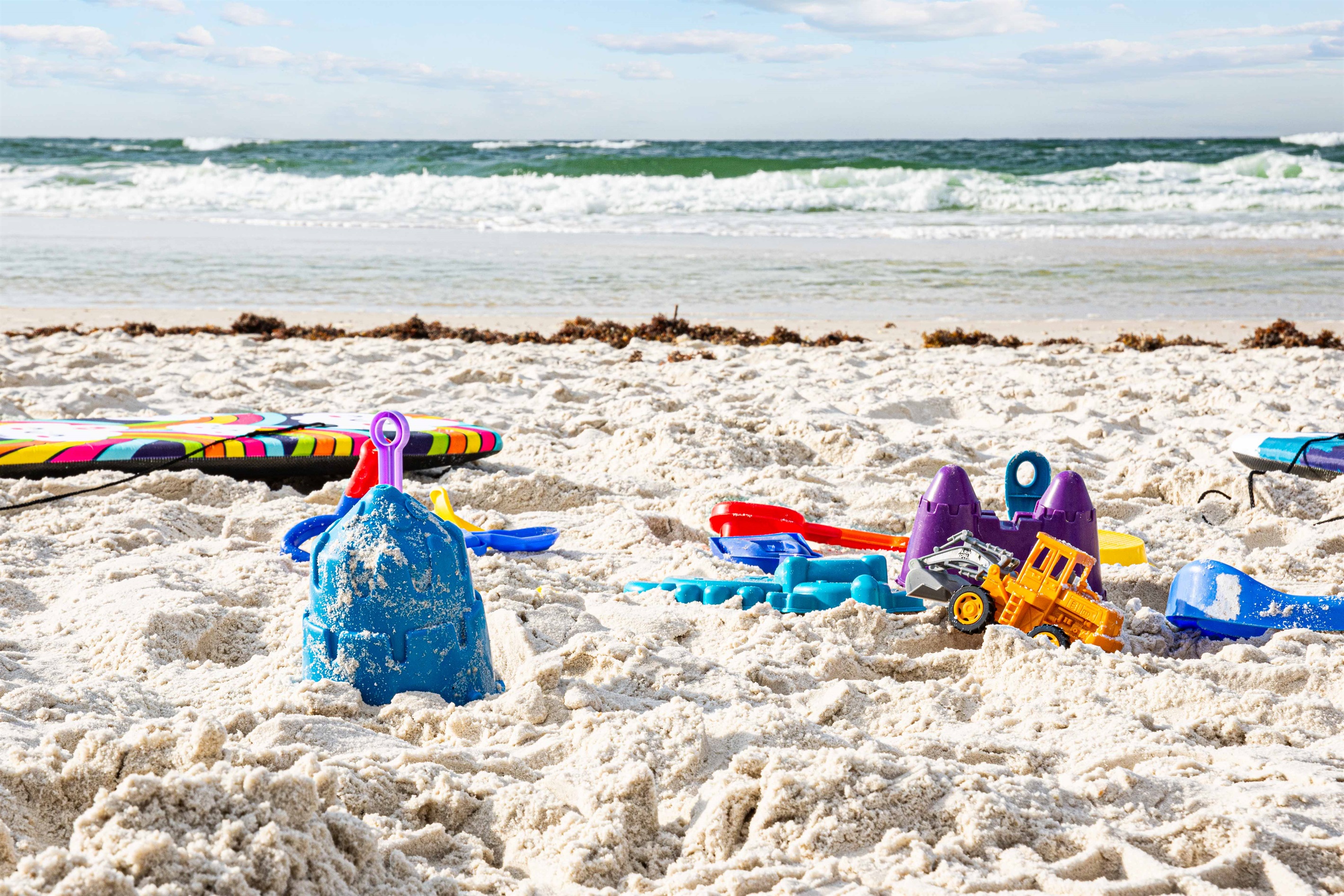 Plenty of fun! Kid sized boogie boards, sand toys, spike ball, you name it I bet we have it!