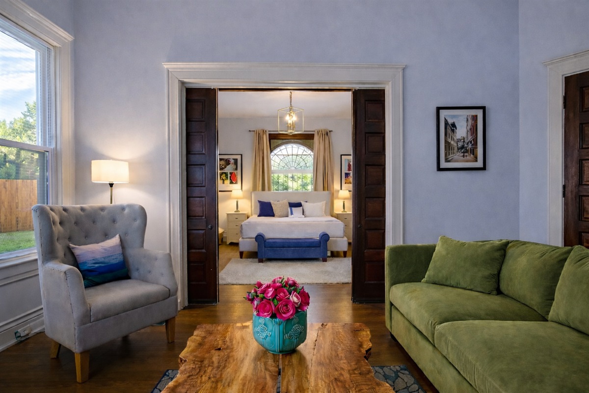 Living Room with Velvet Large Section Sofa and addition side chairs. 55" LED Smart TV.