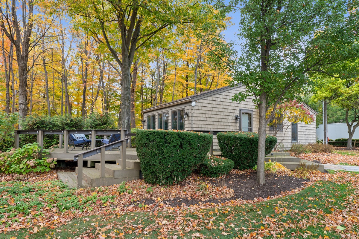 Shaded backyard retreat surrounded by trees and fresh air.