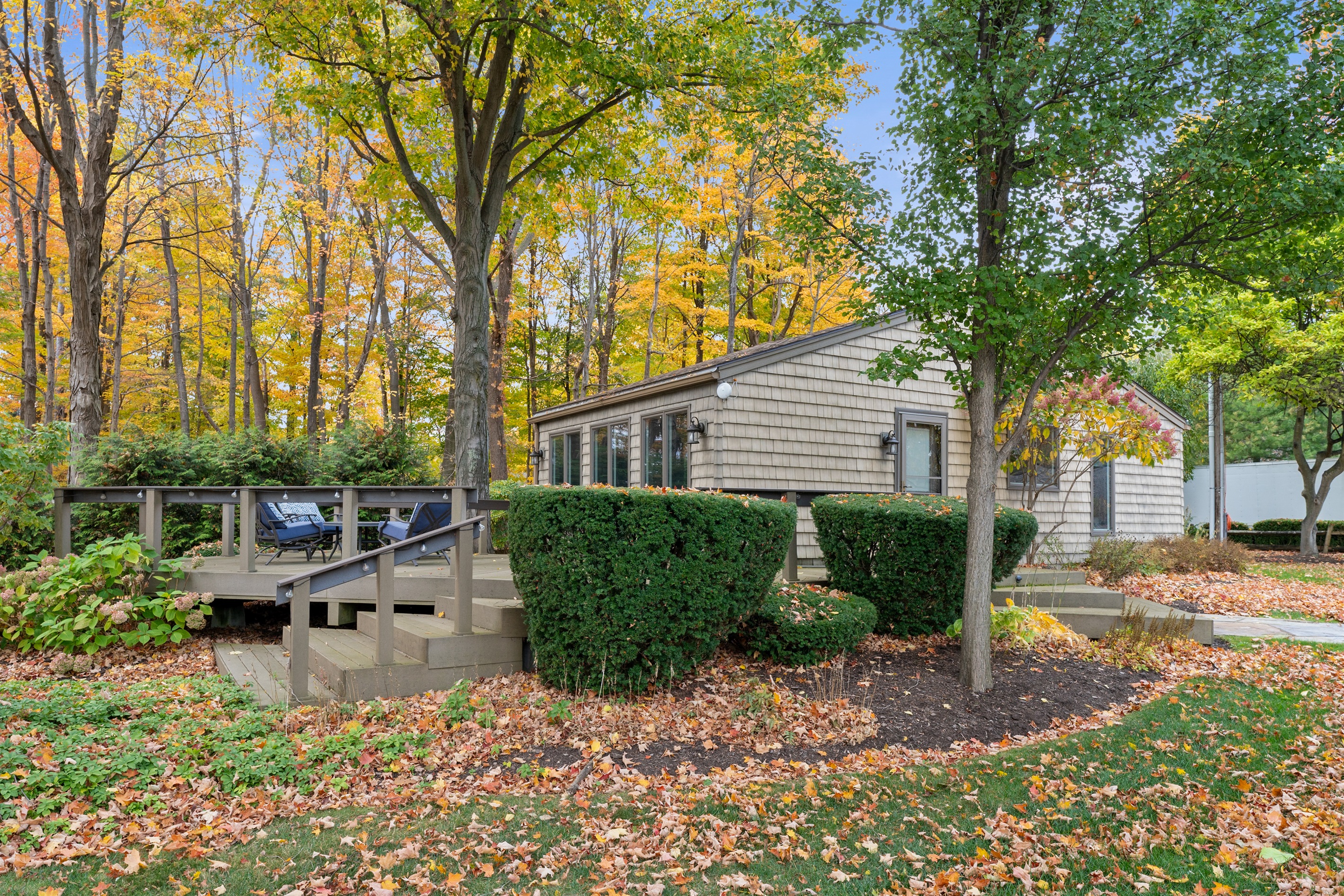 Shaded backyard retreat surrounded by trees and fresh air.