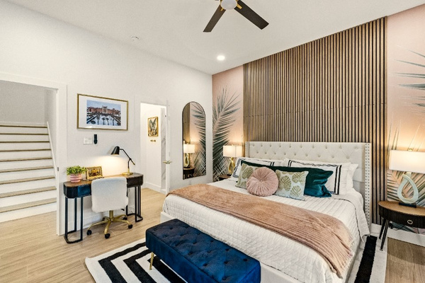 Enjoy luxurious bedding in the Palms of the Grand Galvez themed Primary Suite.