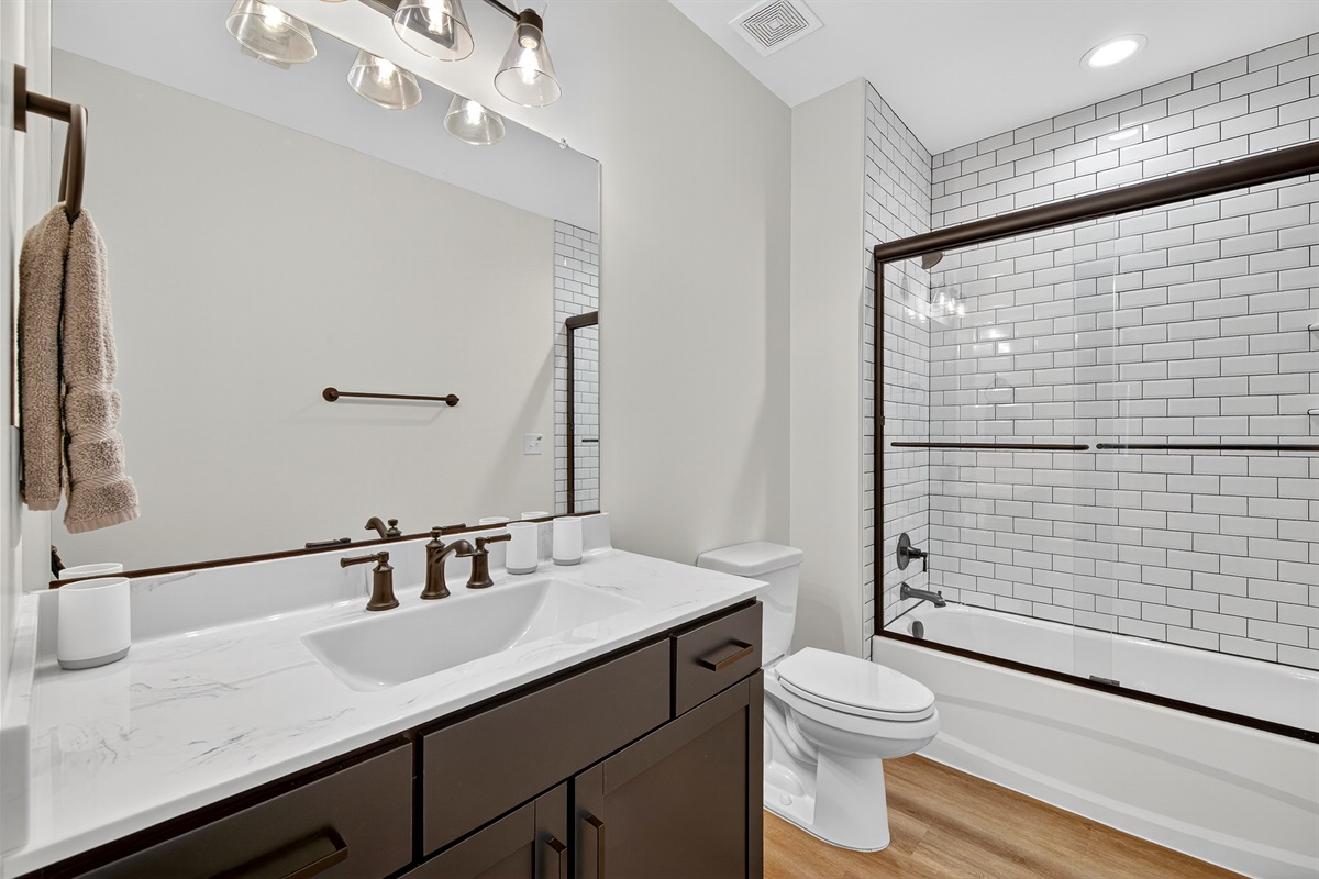 Sleek design meets everyday comfort in this stylish full bath.