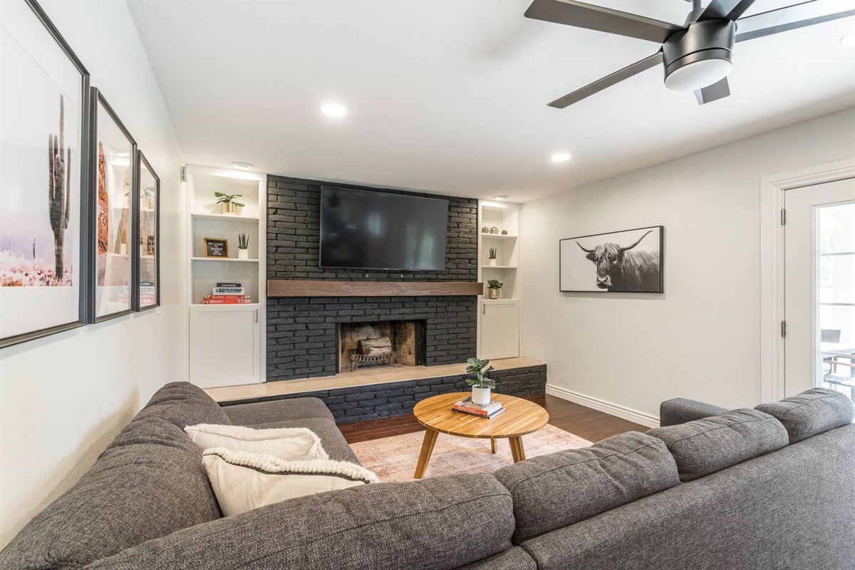 Get comfortable in this family room with fireplace, large flat screen TV, and a sectional with a QUEEN SOFA BED.Board games are provided for Game Night!