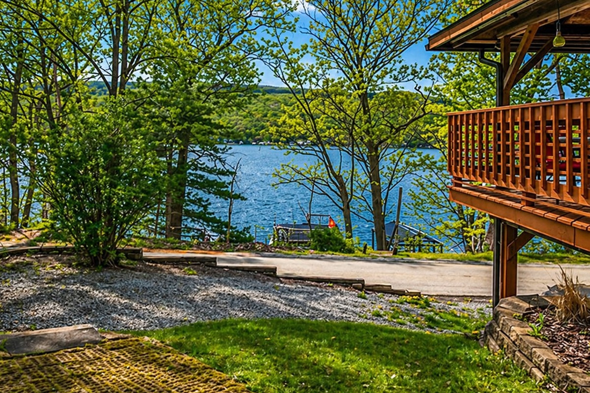 Enjoy peaceful lake views just steps from your front door! 🌿 This cozy outdoor space offers the perfect blend of privacy and scenic beauty with direct access to the water across the road. 🌊✨