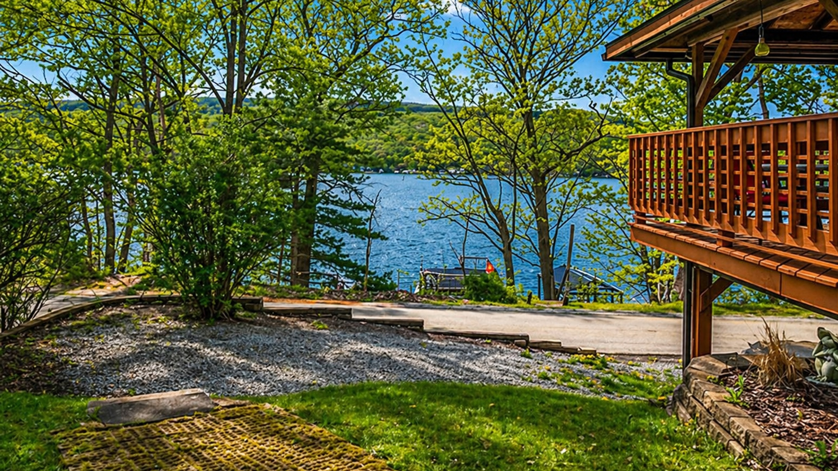 Enjoy peaceful lake views just steps from your front door! 🌿 This cozy outdoor space offers the perfect blend of privacy and scenic beauty with direct access to the water across the road. 🌊✨