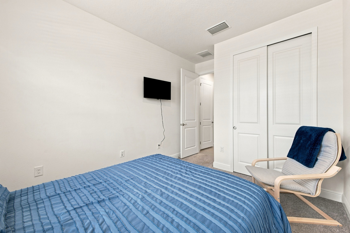 Television and Slider Closet in Queen Bedroom 
