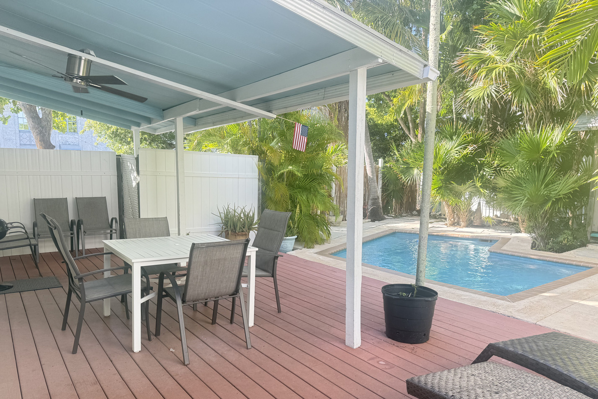 Unwind in your private tropical oasis, where lush greenery surrounds a serene pool. Sip your morning coffee or enjoy an al fresco meal on the spacious deck