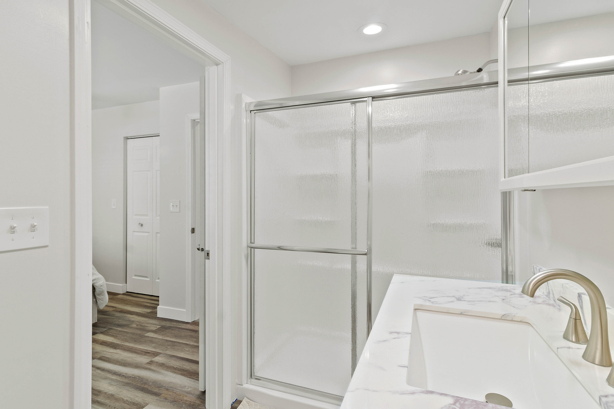 The Waterbury Way - Primary Bath Shower with Rainfall Doors