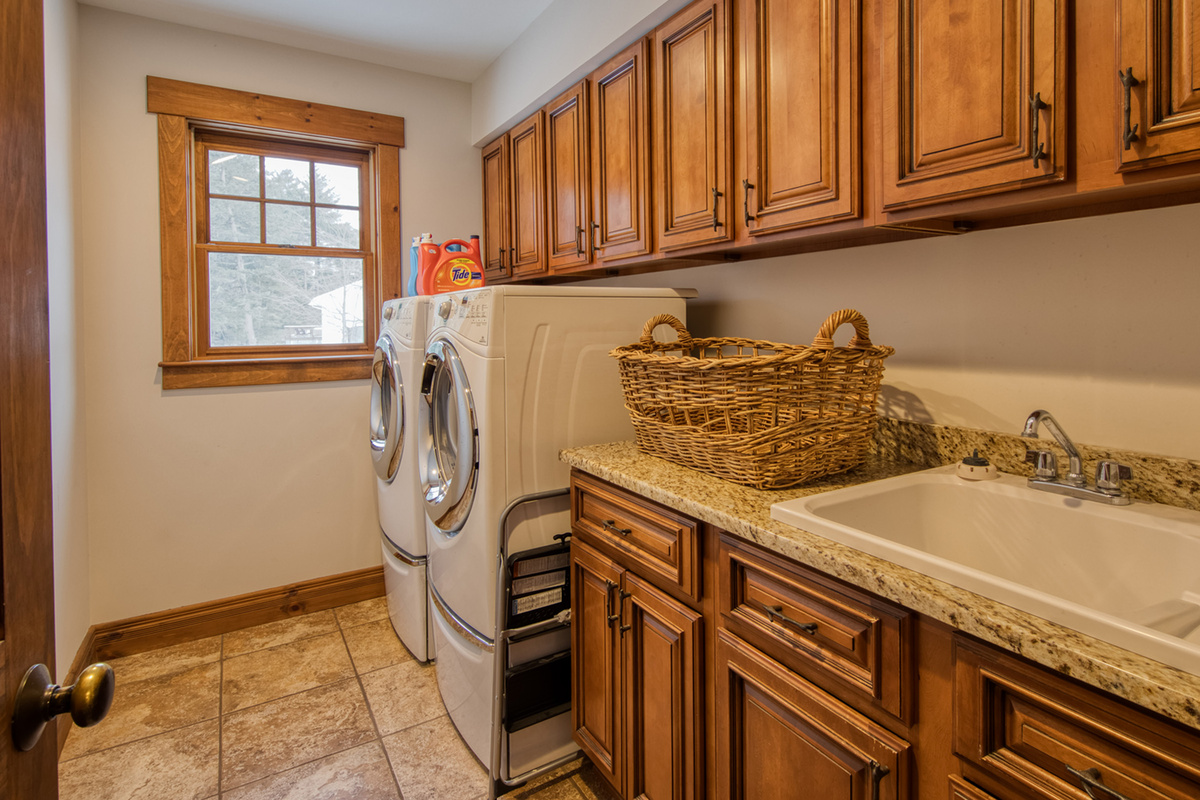 Convenient main-floor laundry room makes extended stays easy and comfortable.