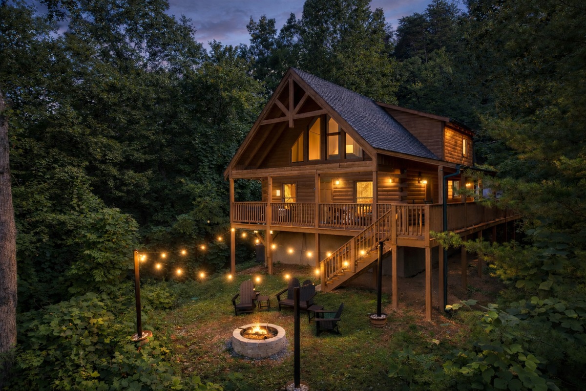 Relax under the string lights, soak in the hot tub, and enjoy the peaceful mountain views.