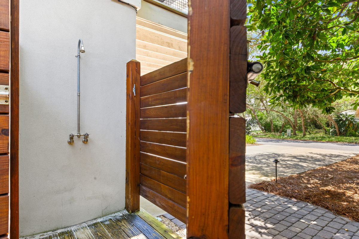 The ultimate beachside convenience—rinse off the sand and saltwater before heading inside.
