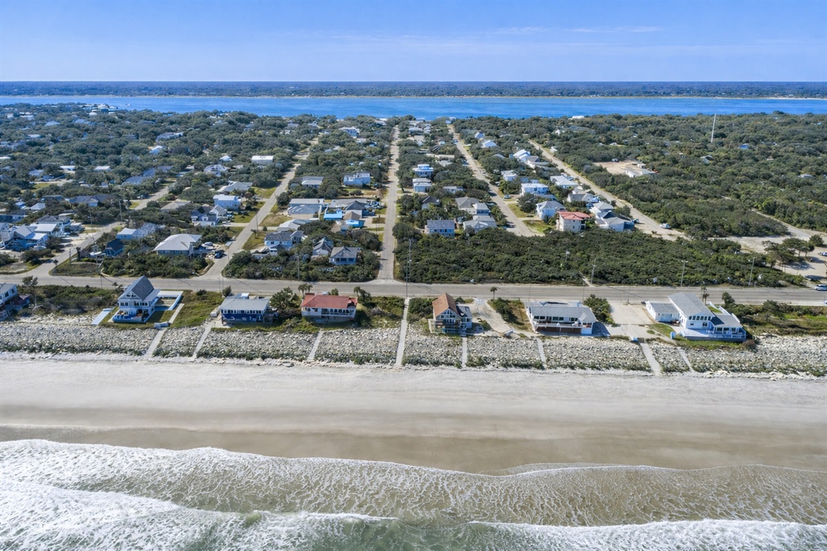 True Blue Cottage is located in a charming beach neighborhood, surrounded by water on both sides.