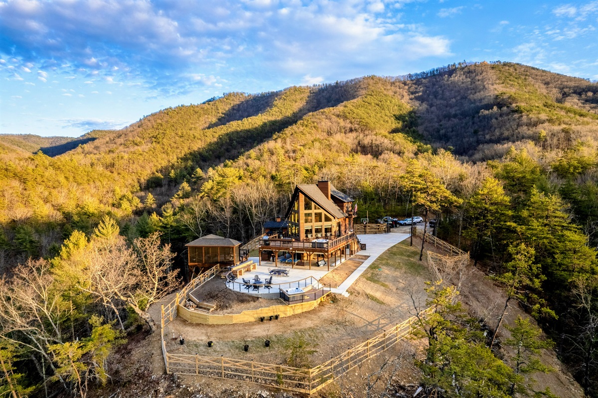 Summit Retreat – Perched high atop a private mountain, this stunning A-frame lodge offers unmatched seclusion, sweeping views, and luxurious outdoor living.
