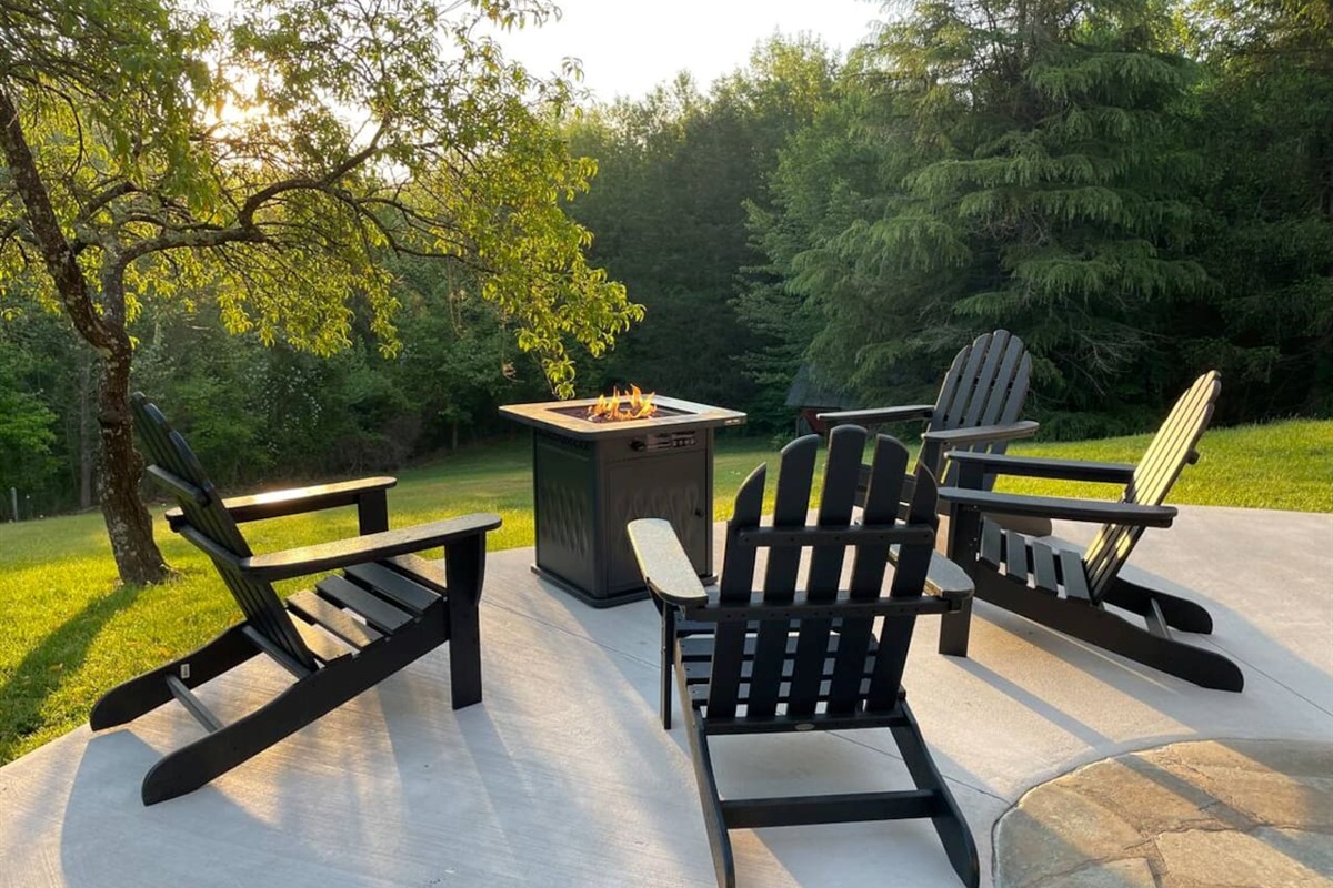 Outdoor seating surrounding the fire pit is shared with any other guests staying in the private suites.