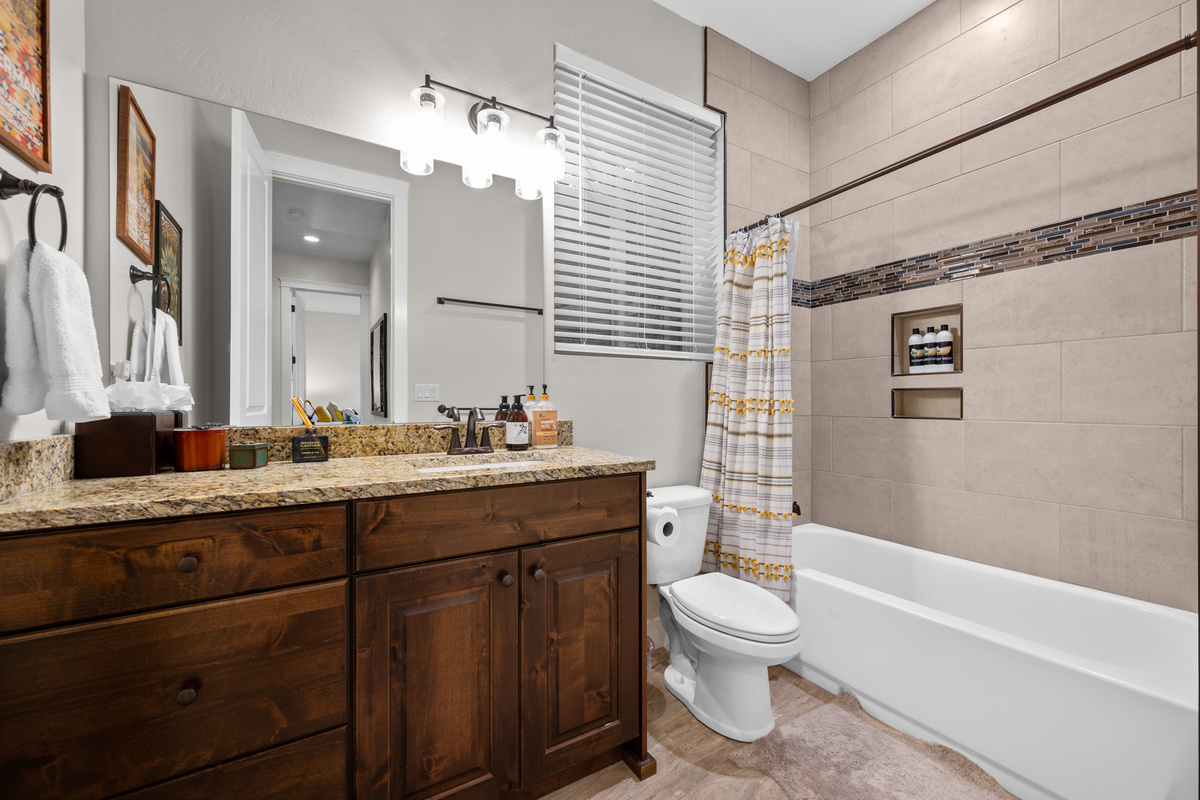 Beautiful downstairs bathroom conveniently located near the guest bedrooms.
