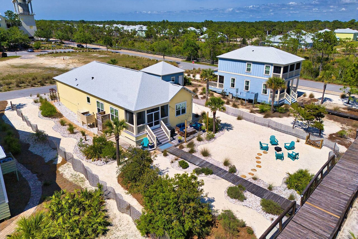 Coastal oasis from above. Enjoy a bird's-eye view of this beautiful beach home, spacious outdoor living areas, and peaceful surroundings