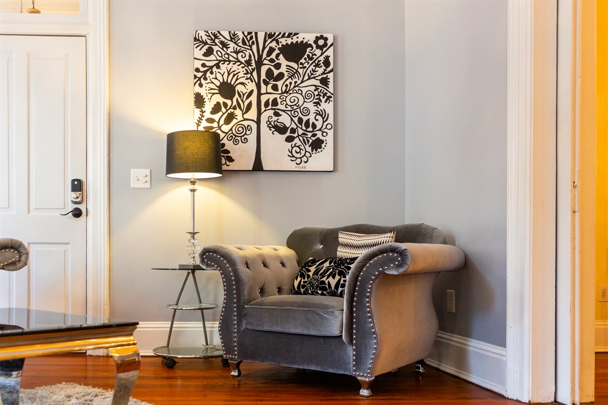 Curl up with a book or morning coffee in this cozy armchair corner.