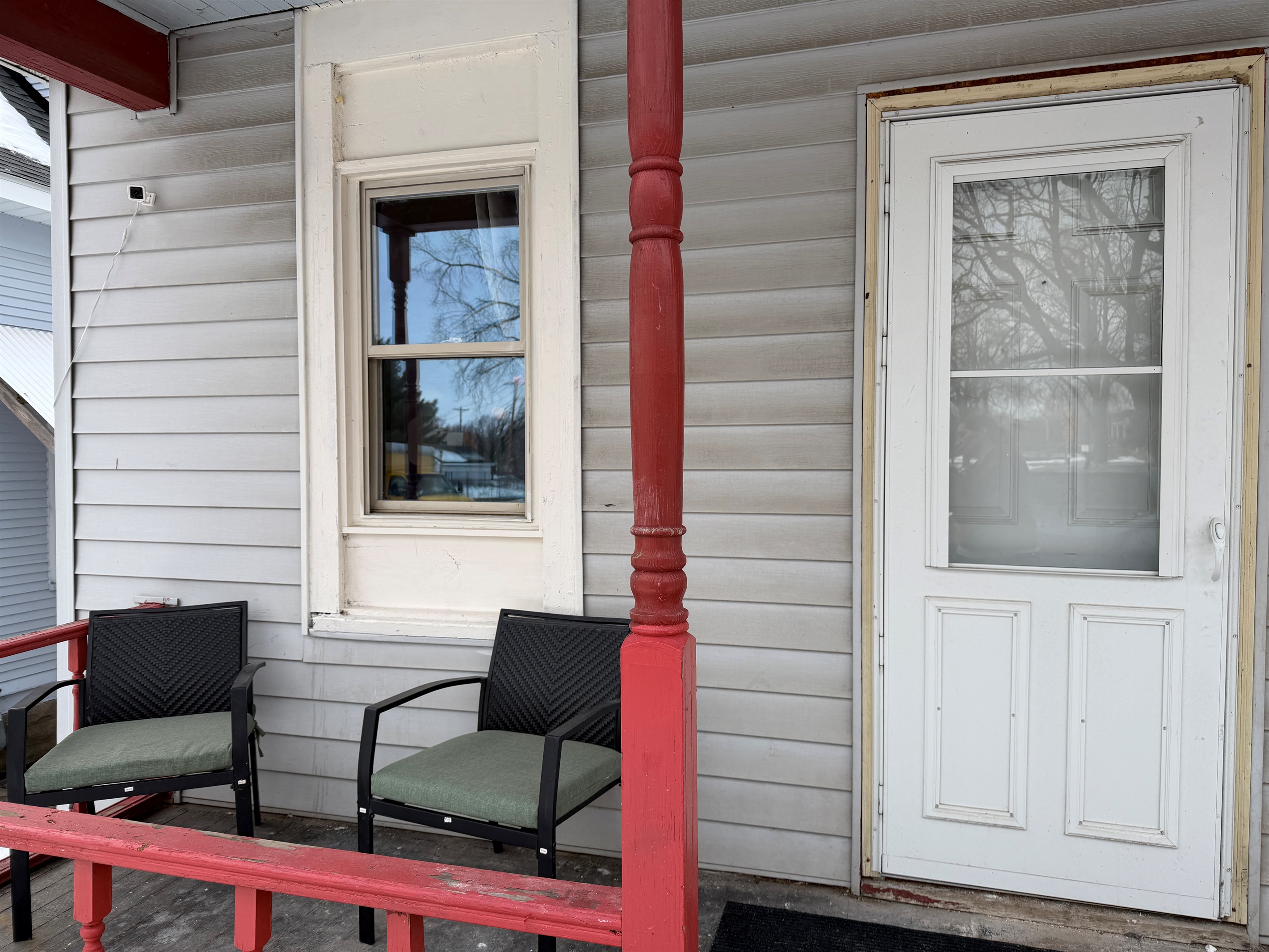 There are two small seating nooks on the front patio.