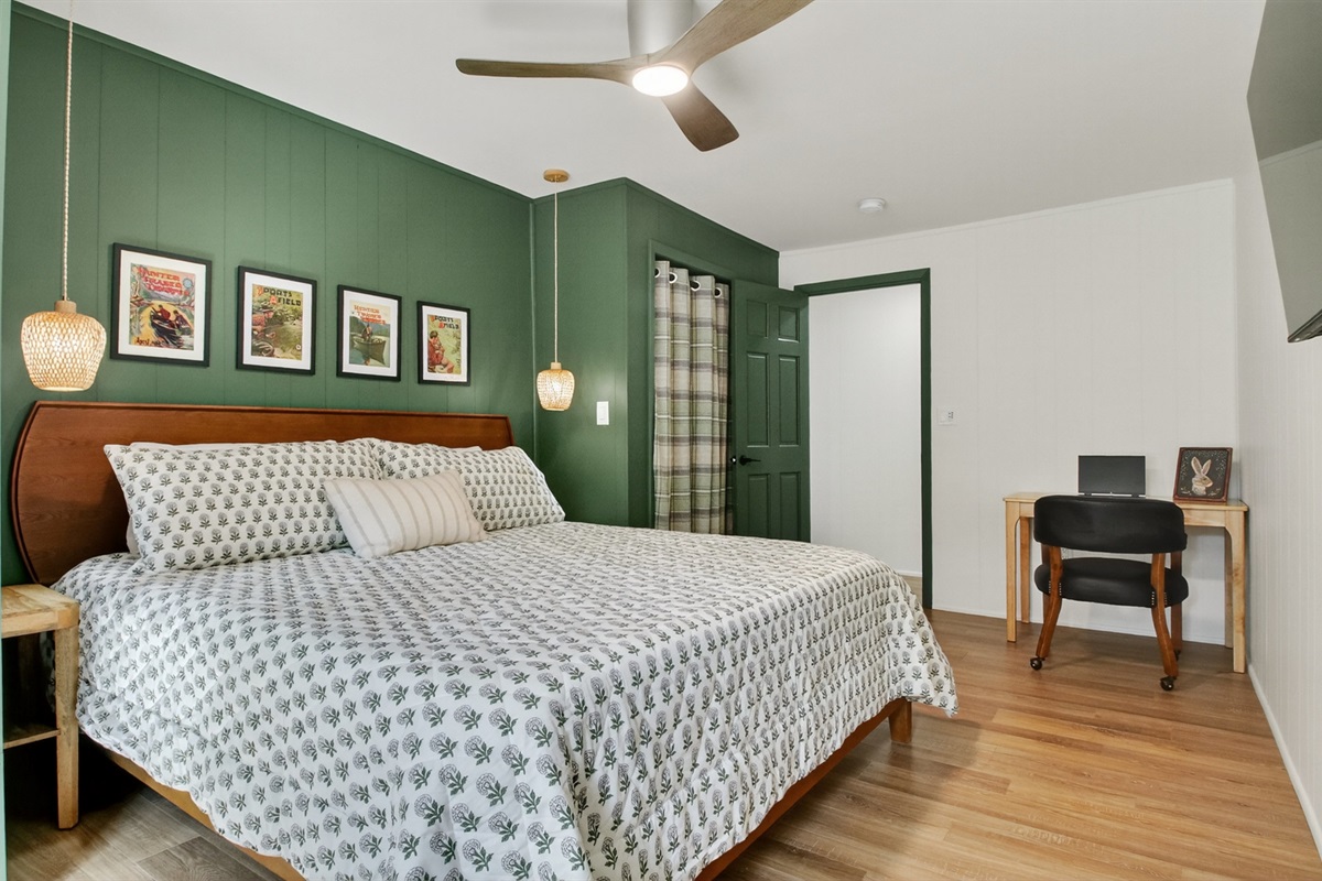 Catch up with the office if needed. This bedroom has a king bed, closet for clothing storage, and desk and office chair.
