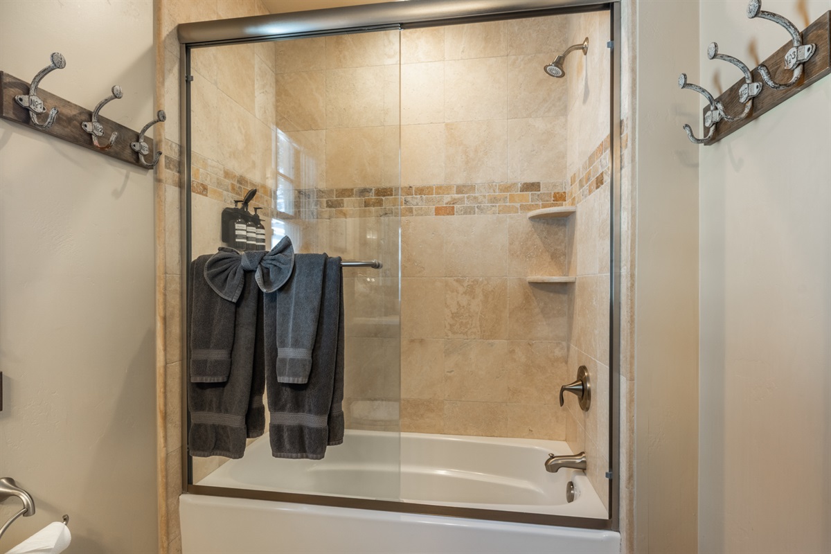 Conveniently located near the living area and bunkroom, this full bath with shower/tub combo keeps mornings and evenings simple.