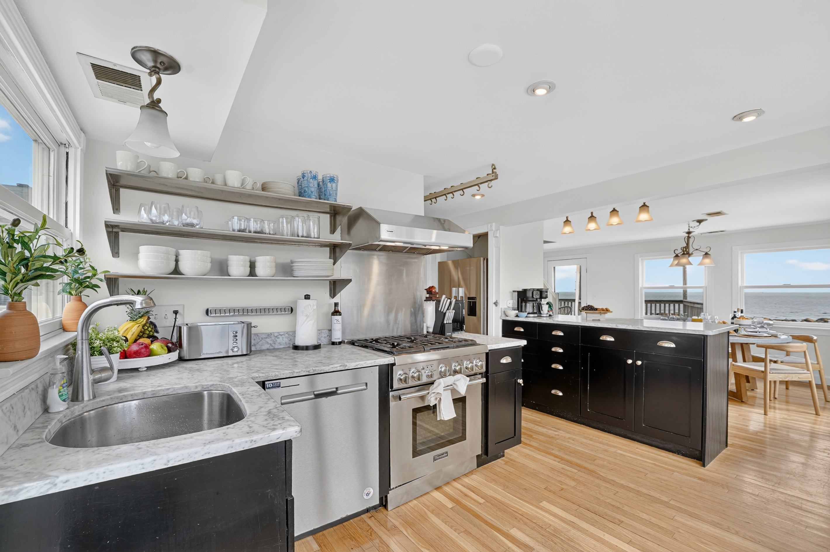 Spacious kitchen with ample workspace, storage, and appliances for convenient meals during your stay.