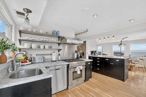 Spacious kitchen with ample workspace, storage, and appliances for convenient meals during your stay.