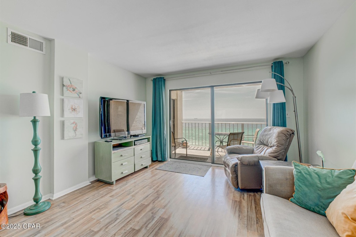 Living room with a gulf view and private balcony.