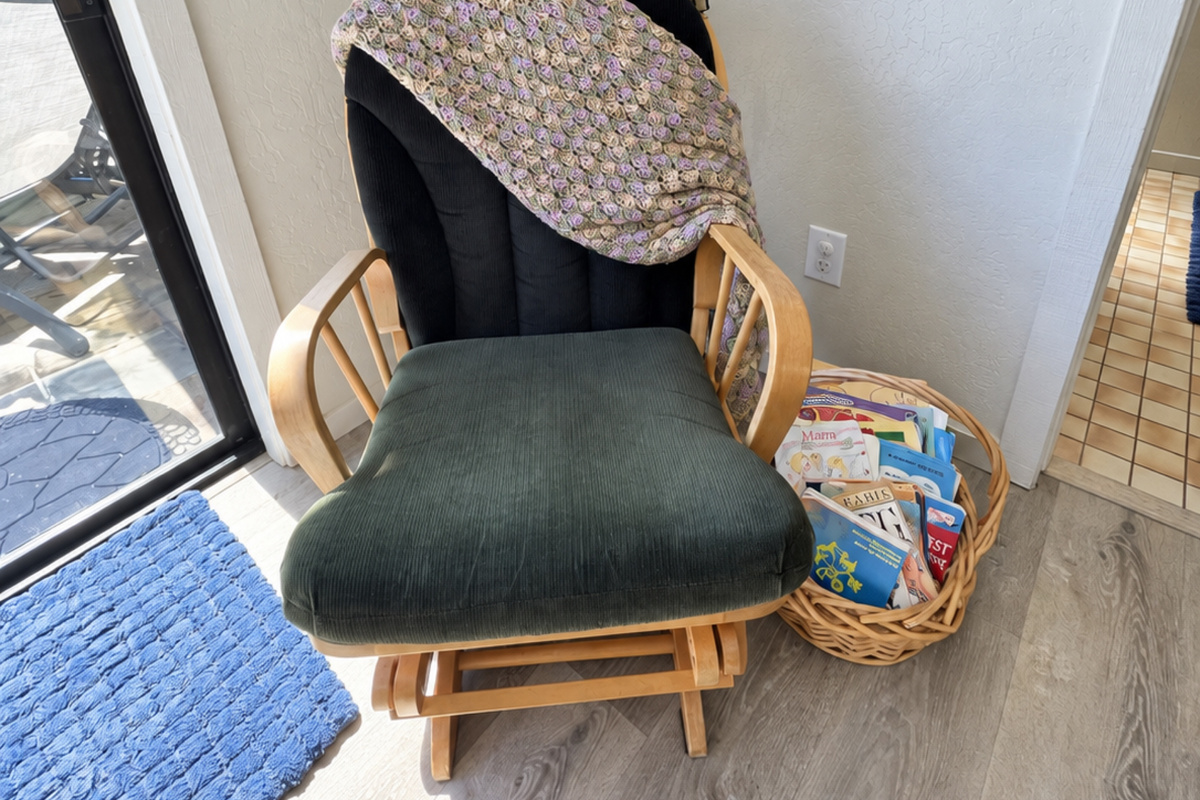 Rocker with basket of children books