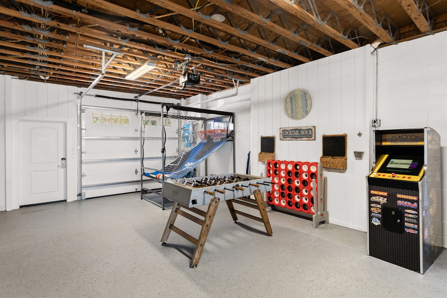 Side A: Game on! Our massive ground-floor game room is packed with fun for all ages, featuring Pacman, foosball, life-size Connect Four, and a basketball shootout. 