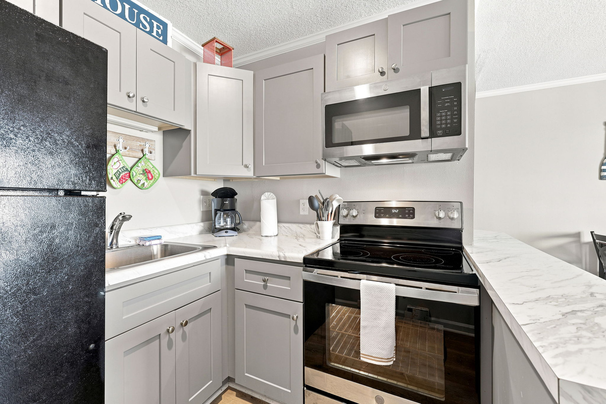 The open-concept design allows the kitchen to flow seamlessly into the living area, creating a comfortable space to relax and reconnect