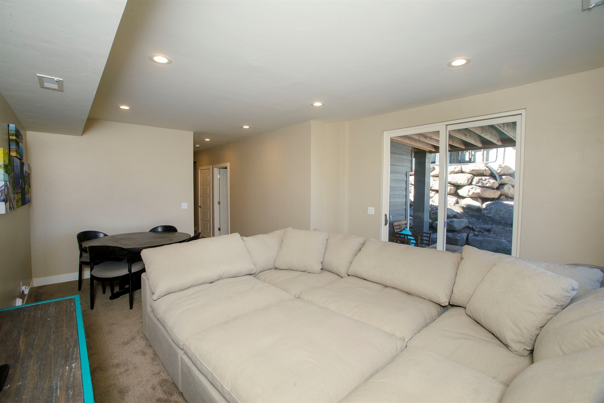 Spacious second family room with plush sectional and room to spread out.