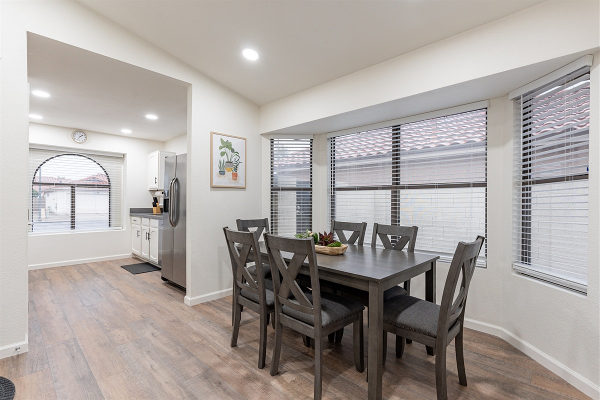Dining room open to kitchen with seating for 6.