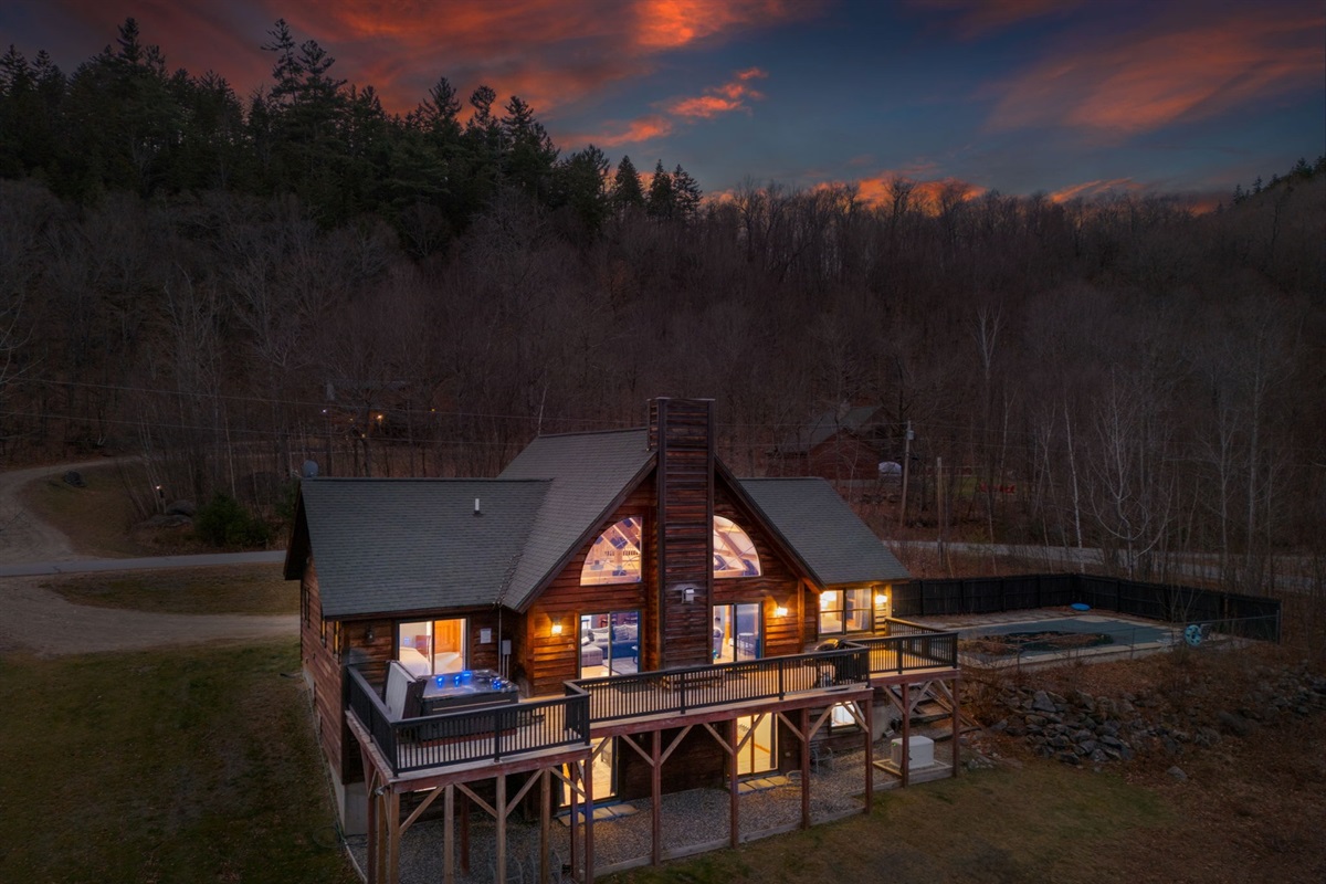 Escape to this stunning mountain cabin with glowing interiors, peaceful surroundings, and total privacy where your whole group can spread out and settle in for a true getaway.