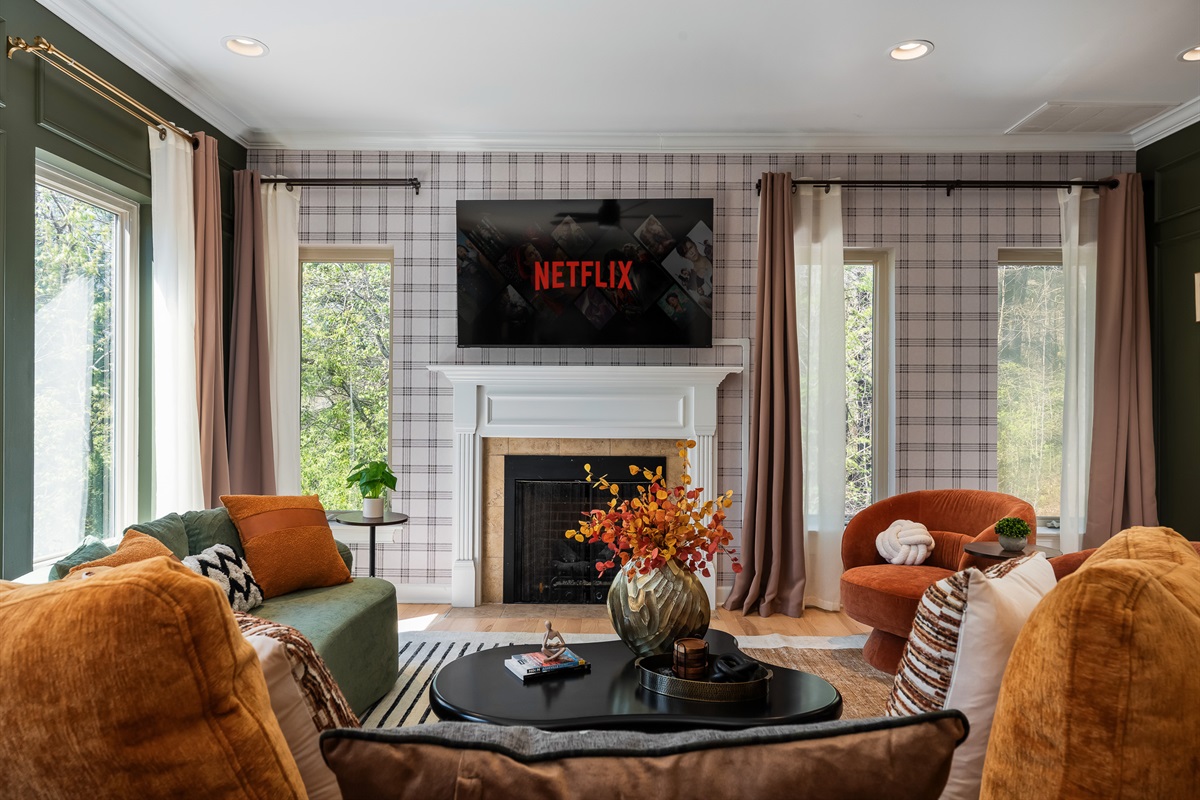 Comfortable living room with fireplace and TV - perfect for relaxing after a day exploring Asheville