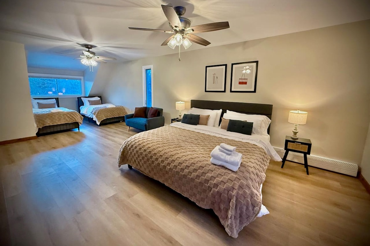 Unit B Bedroom w/ 1 King and 2 Twin Beds