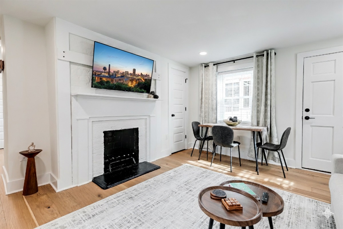Living Room Retreat: Bright space with sleek decor and a cozy dining nook. Perfect for relaxation!