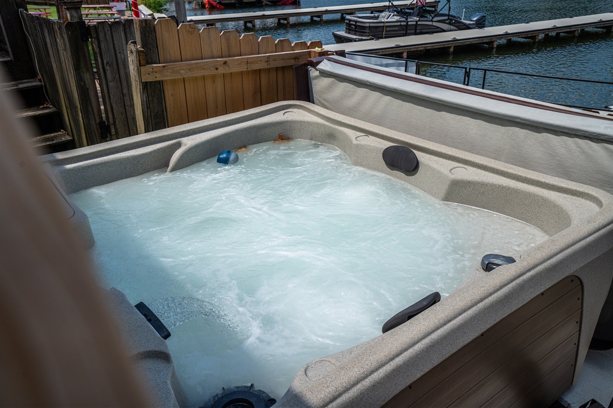 Hot Tub Haven: Relax in the bubbling hot tub with stunning lakeside views! Pure bliss awaits!