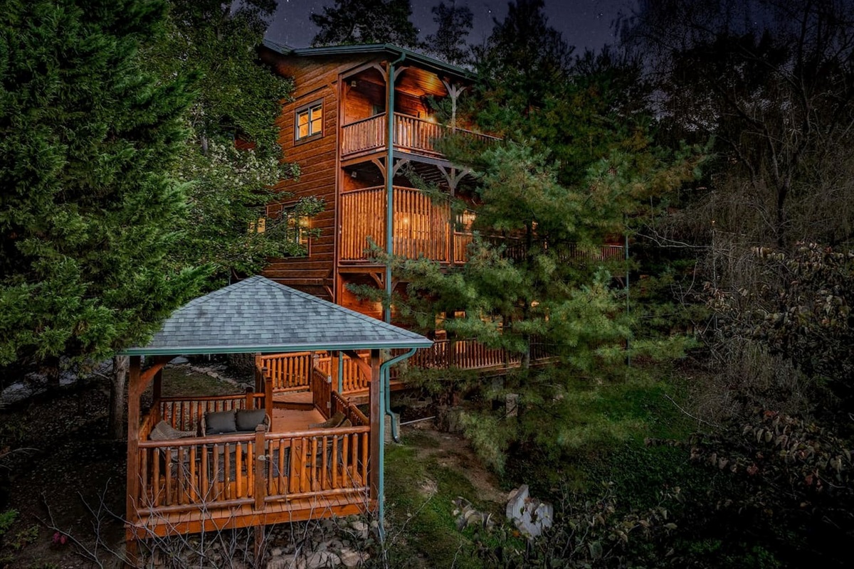 Private covered gazebo with seating for 8. Outdoor entertaining space for groups at The Crown Jewel &mdash; luxury Gatlinburg cabin rental for 12.