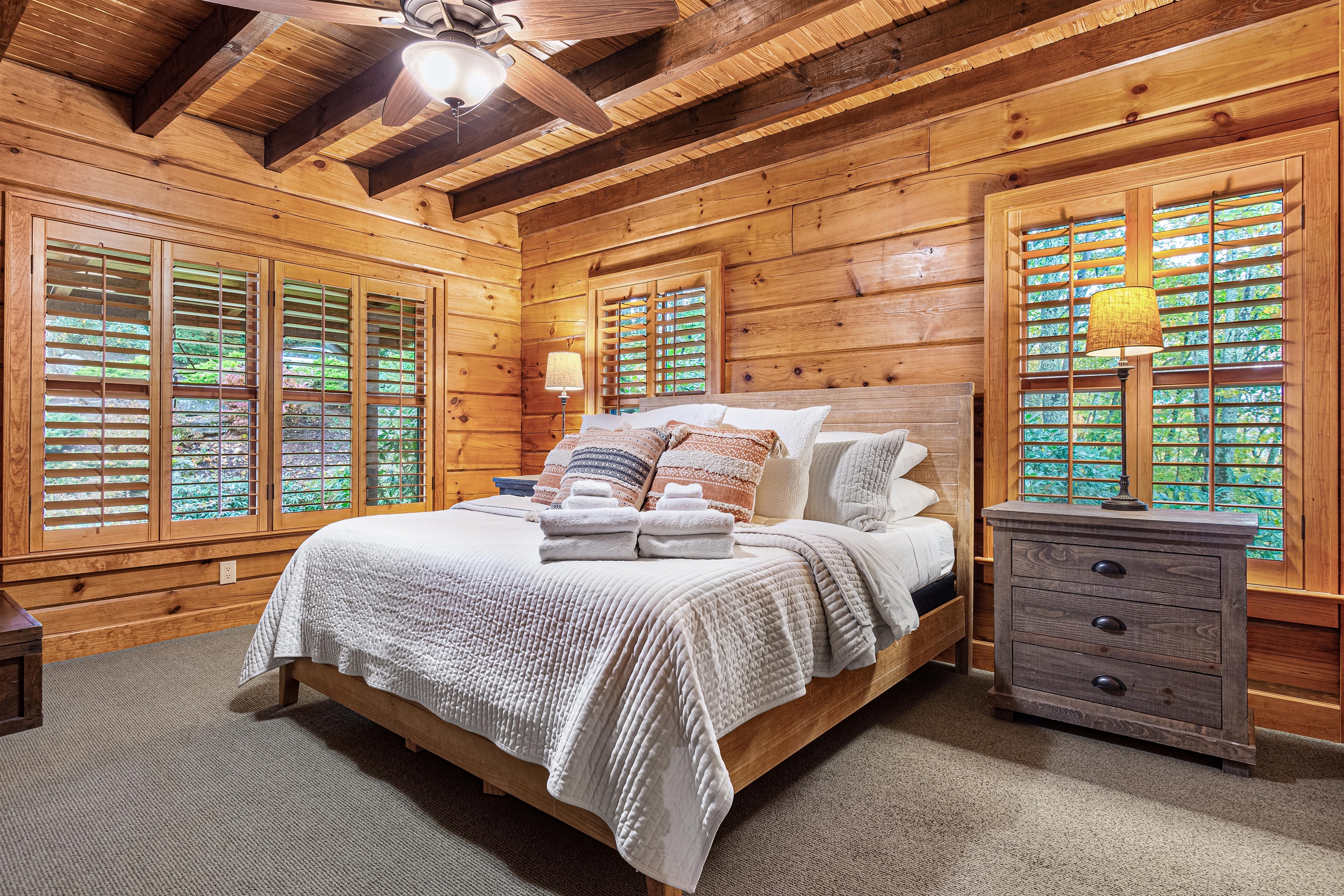 Main floor master bedroom with a new king sized bed and luxury linens.