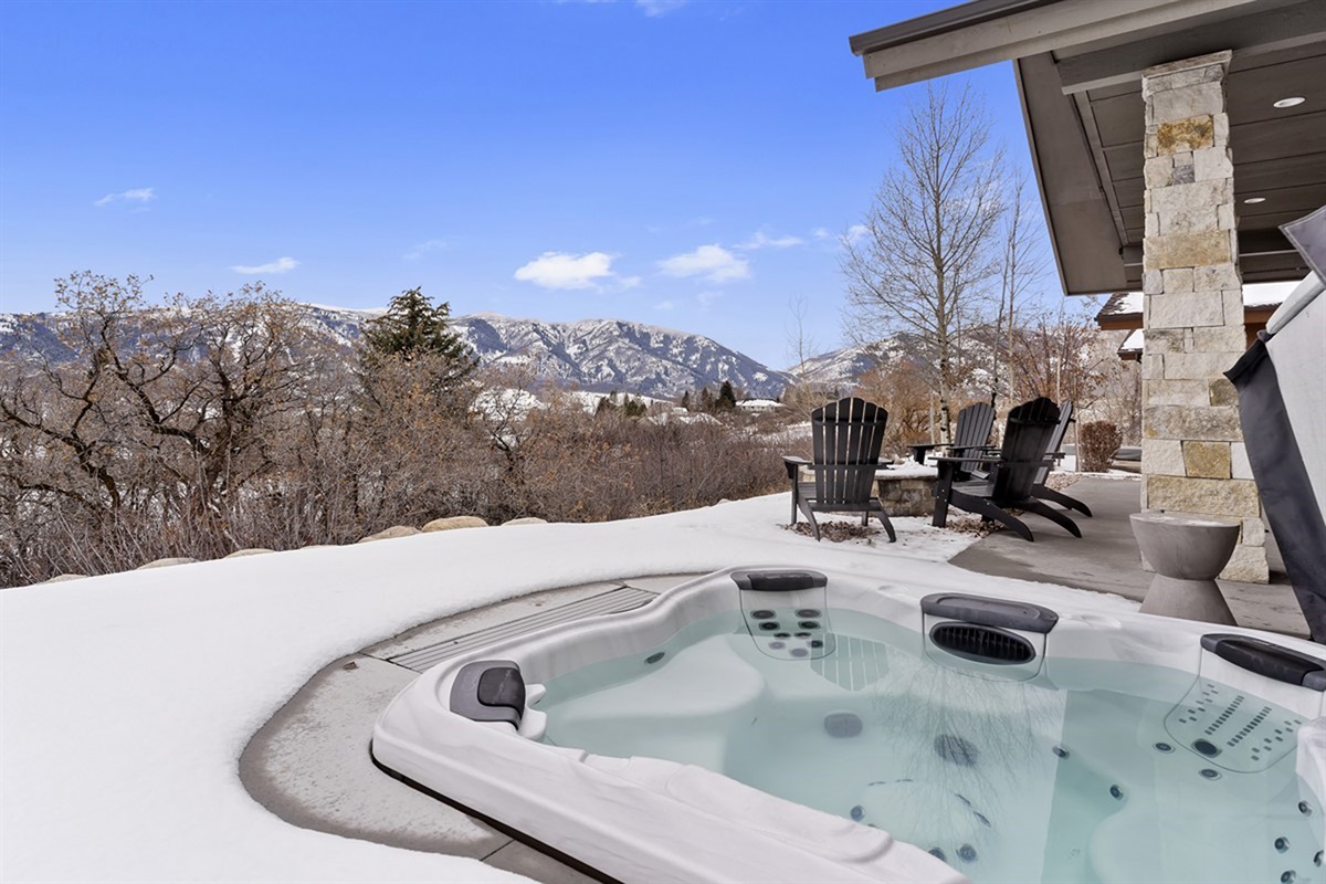 Step into the hot tub and soak in the mountain scenery—perfect after a day of exploring.