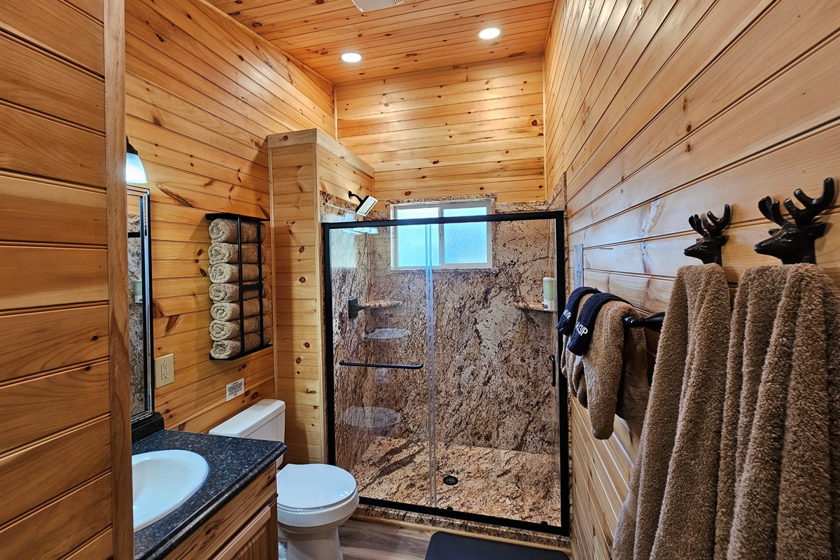 Wash away the day in this spacious walk-in shower, then wrap yourself in fluffy towels for a spa-like cabin touch.