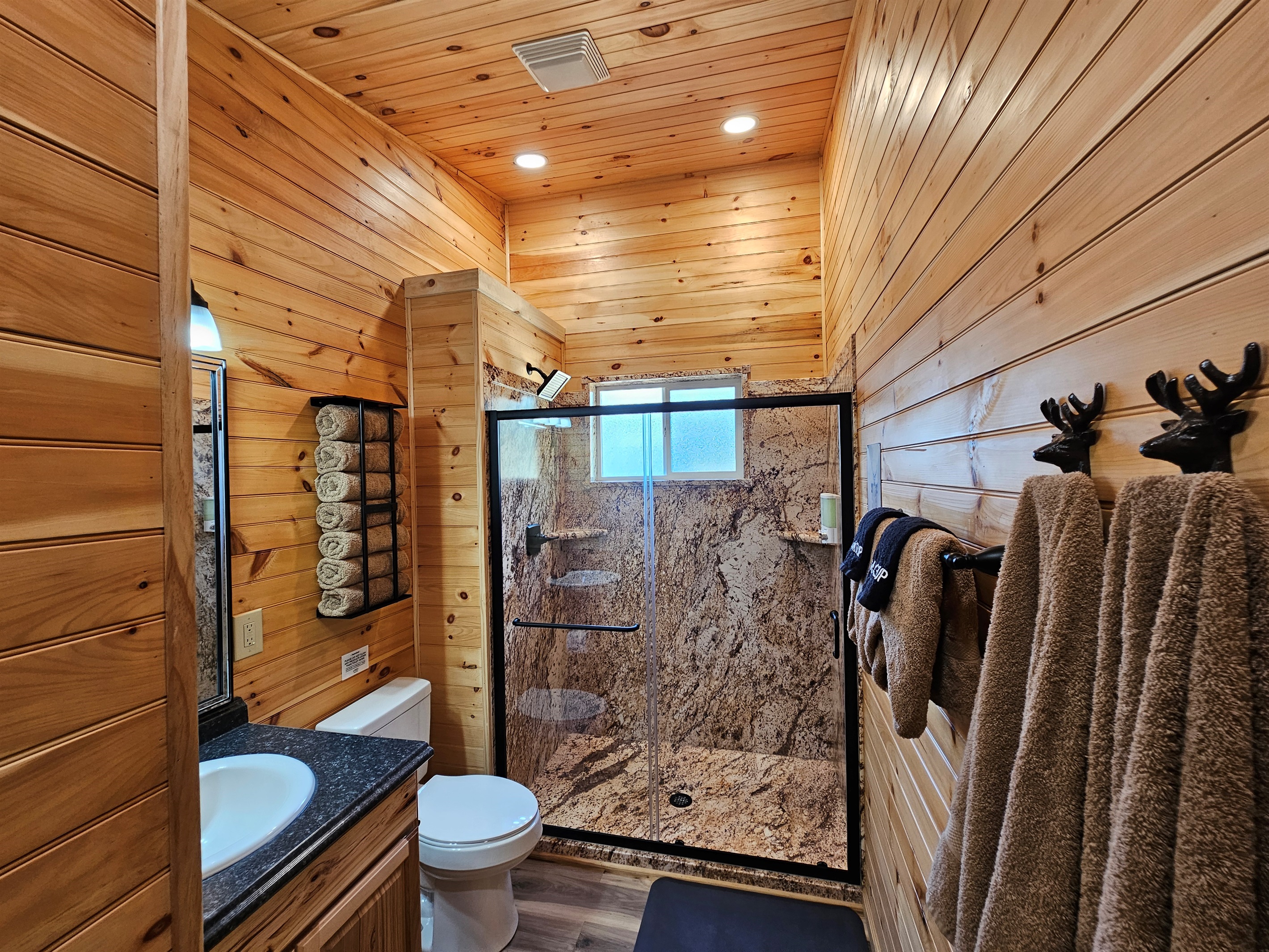 Wash away the day in this spacious walk-in shower, then wrap yourself in fluffy towels for a spa-like cabin touch.