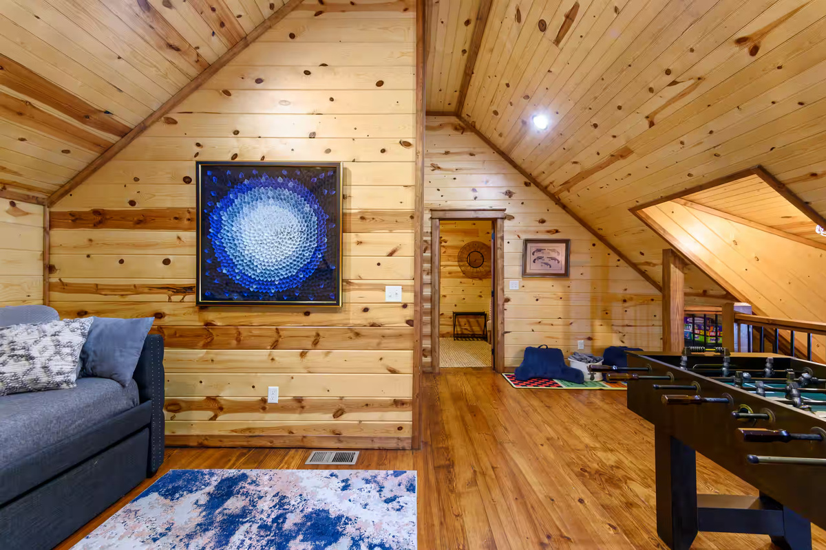 Loft Lounge: Enjoy vibrant art and wooden beams in this fun, spacious retreat with games!