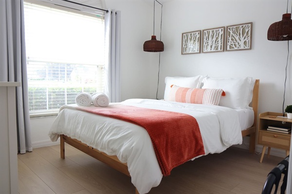 Serene bedroom with  Queen sized bed and black out curtains