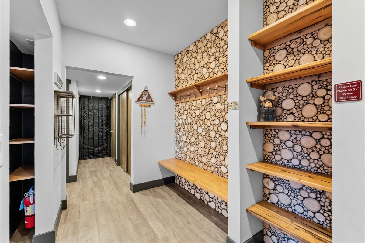 Entry door to condo, bench, shelves and hooks for your gear