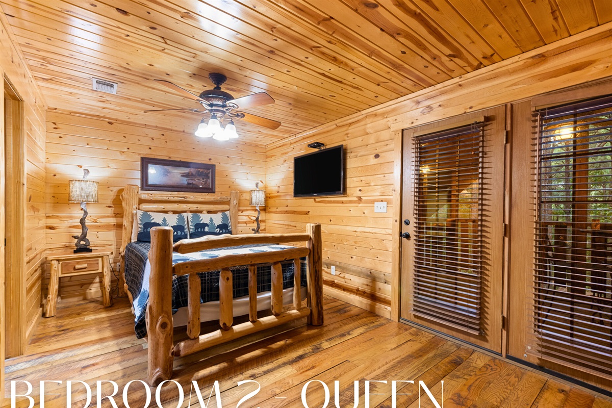 Bedroom 2 alternate angle with queen bed and patio doors