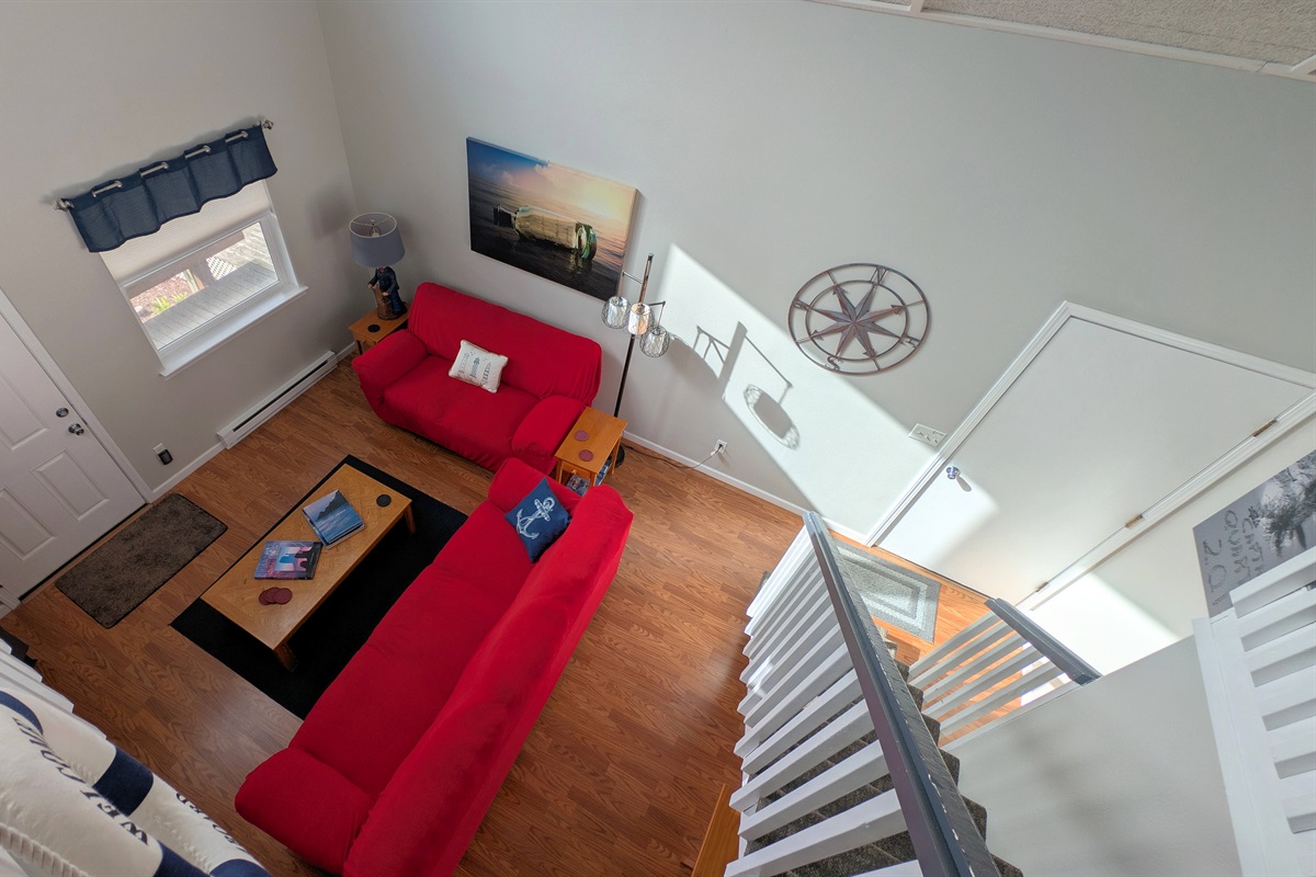 looking down from loft at main floor living room