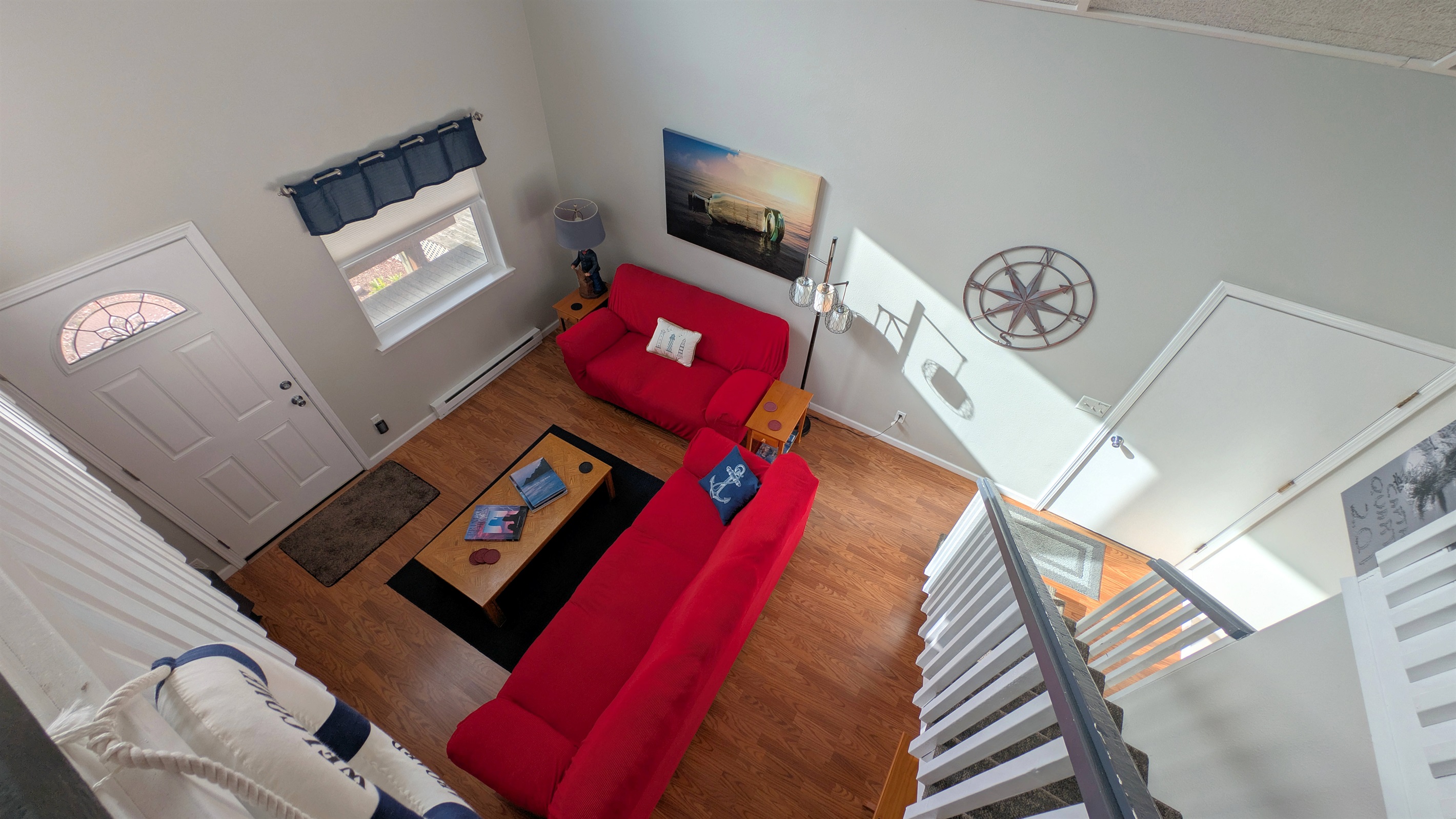 looking down from loft at main floor living room